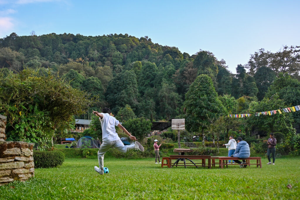 Guests enjoying outdoor activities and games at Kalsee Eco Lodge in Nepal surrounded by nature