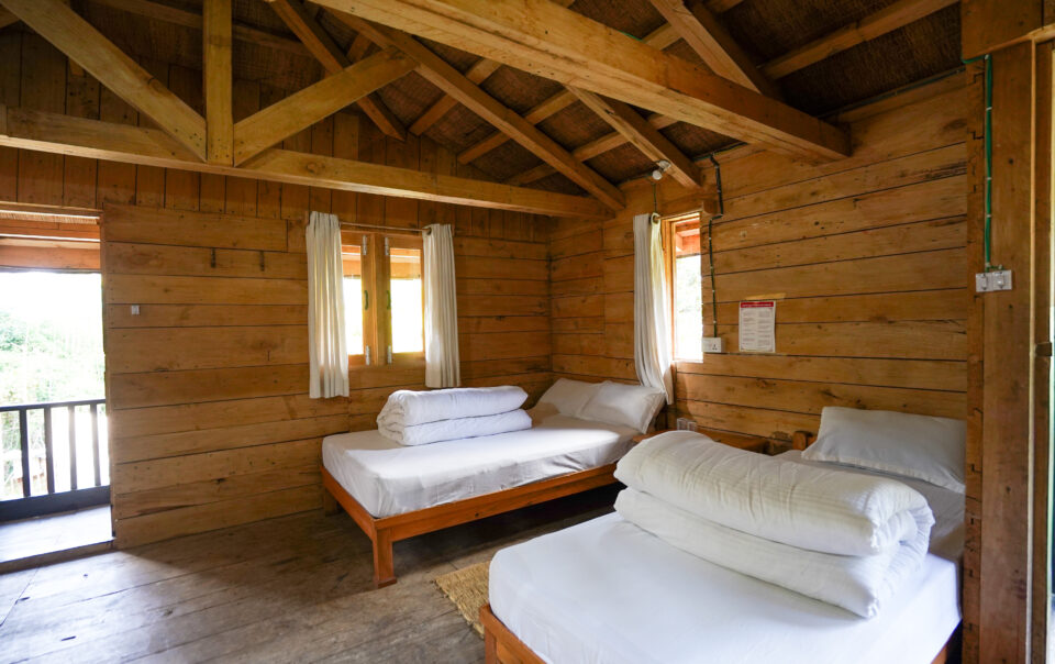 Comfortable guest room with bed and cozy furnishings at Kalsee Eco Lodge Nepal